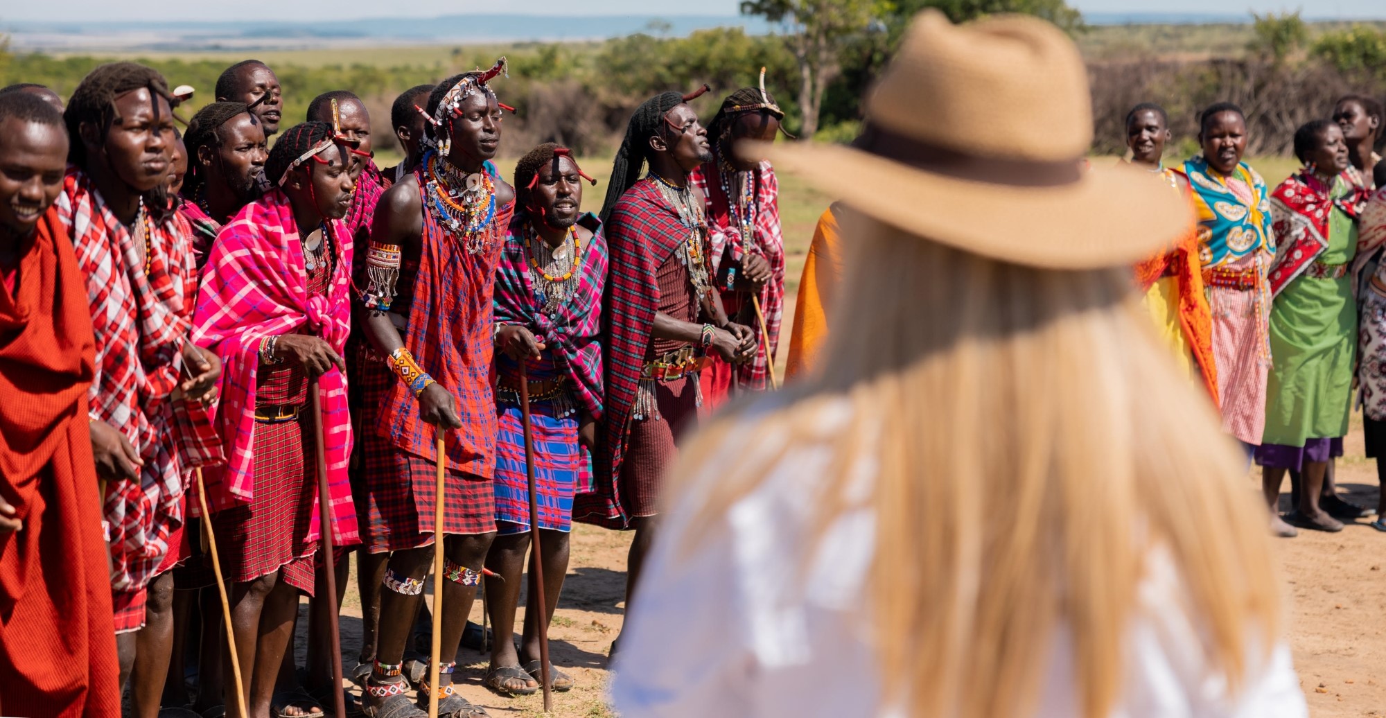 Maasai warriors jumping traditional boma visit