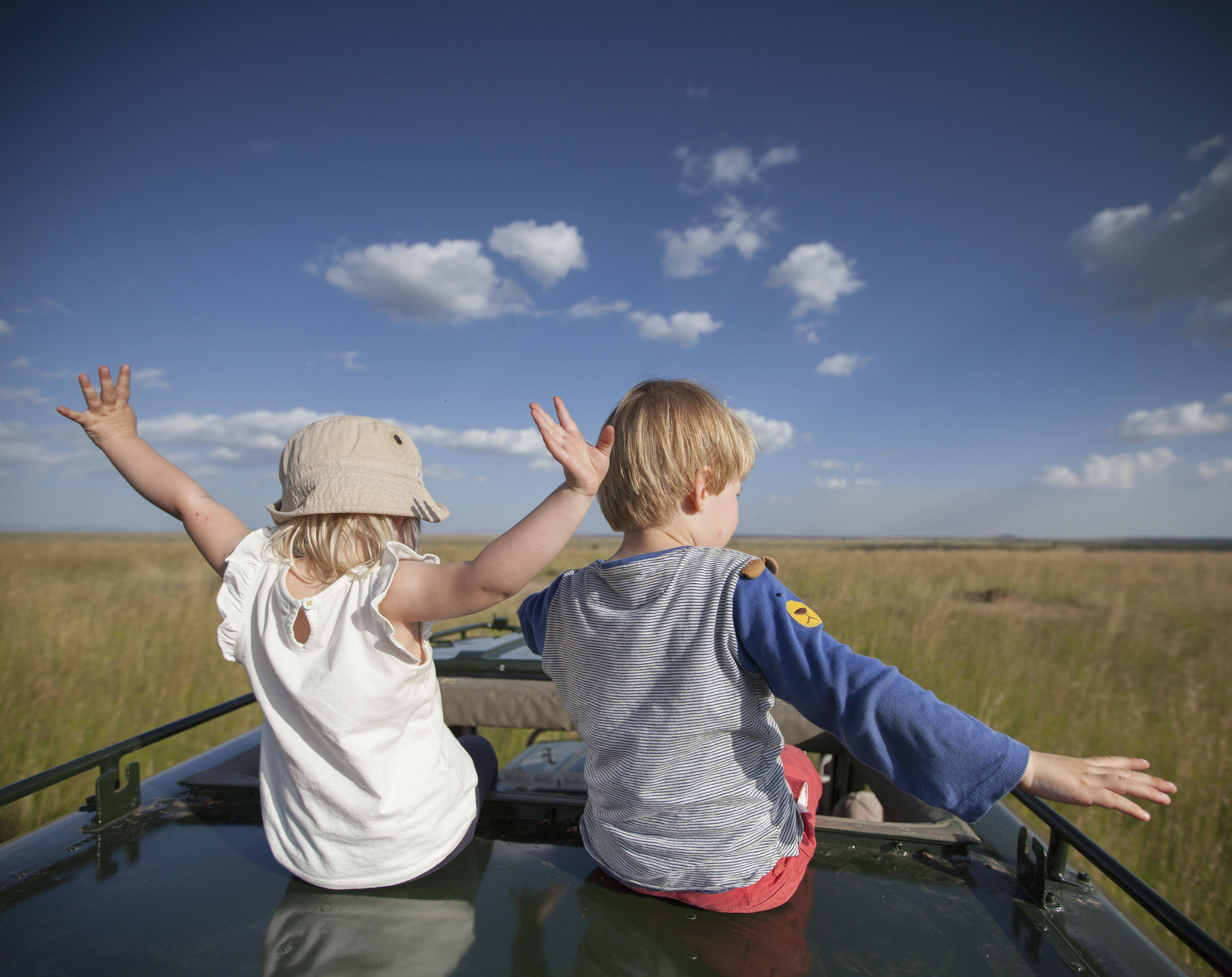 Family on a game drive looking at wildlife